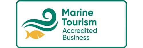 Marine Tourism Accredited Business badge with waves and fish.