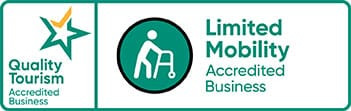 Logos for Quality Tourism and Limited Mobility Accredited Business with walker symbol.